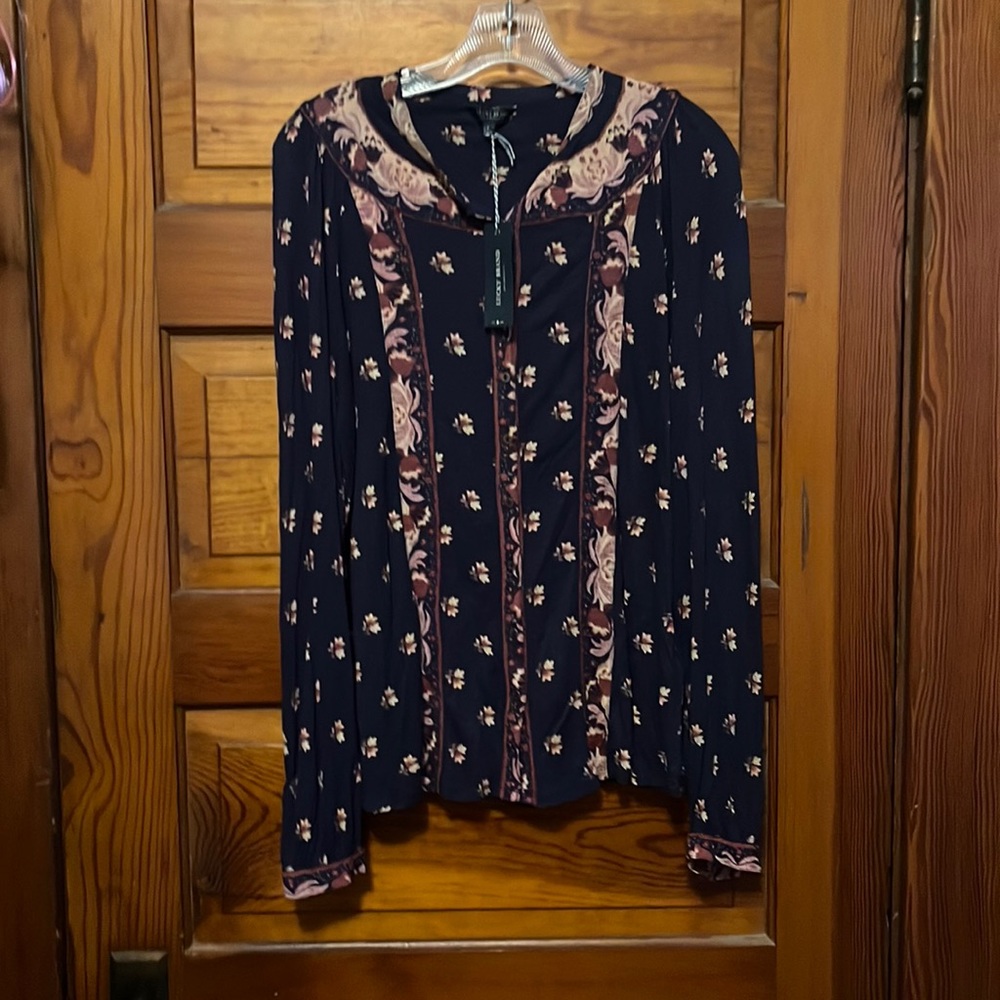 Long sleeve button up. Size large. New with tags.
